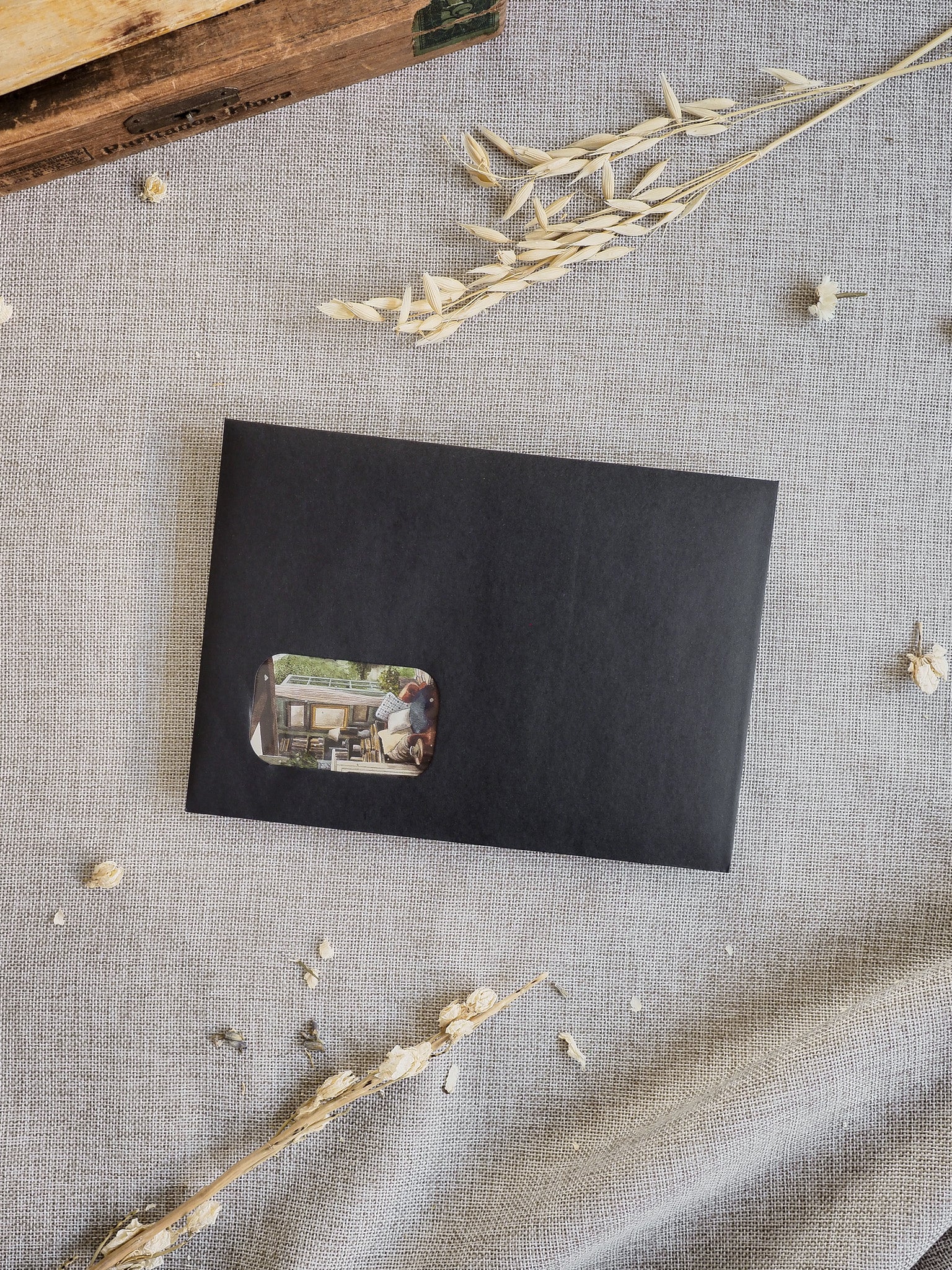 Dark black kit journal featuring a scenic, horizontal photograph of a rustic wooden porch setting for the March 2026 planning collection.