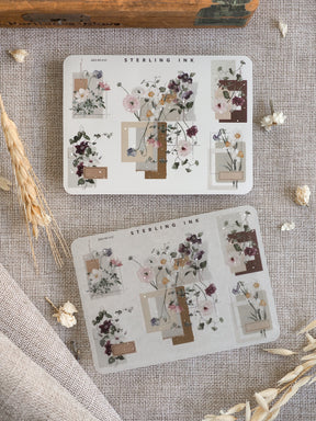 Highly decorative sticker sheets showcasing romantic watercolor florals, muted pink roses, and tailored corner accents in soft earth tones.