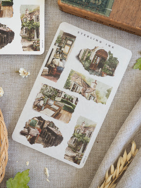 Decorative set of distressed paper stickers showcasing charming vintage illustrations of rustic stone cottages and idyllic English countryside architecture.