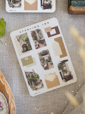 Detailed sticker sheet showcasing architectural elements, including miniature houses, arched entryways, and neutral cream-colored icon boxes for journaling and planning.
