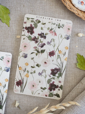 Elegant sticker strip featuring a delicate watercolor bouquet pattern of blush pink, mauve, and deep purple spring flowers.