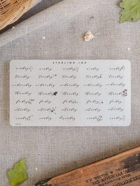 Weekly planning sticker sheet featuring elegant black labels for every day, from Monday through Sunday, perfect for organizing academic schedules or journaling.