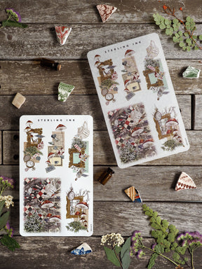 Whimsical sticker sheets featuring detailed woodland scenes, including mushrooms, miniature rustic houses, and botanical arrangements perfect for crafting.
