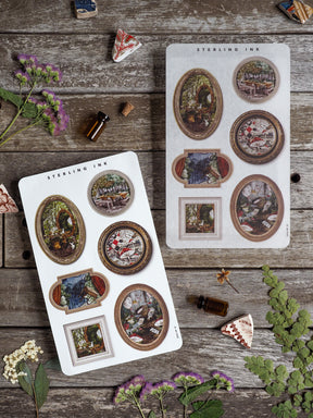 Decorative sheets of picture frame stickers featuring varied sizes of ornate, vintage sepia-toned images perfect for scrapbooking and crafting.