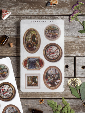 A sheet of vintage picture frame stickers featuring detailed, rustic illustrations of homes and nature, perfect for seasonal scrapbooking.