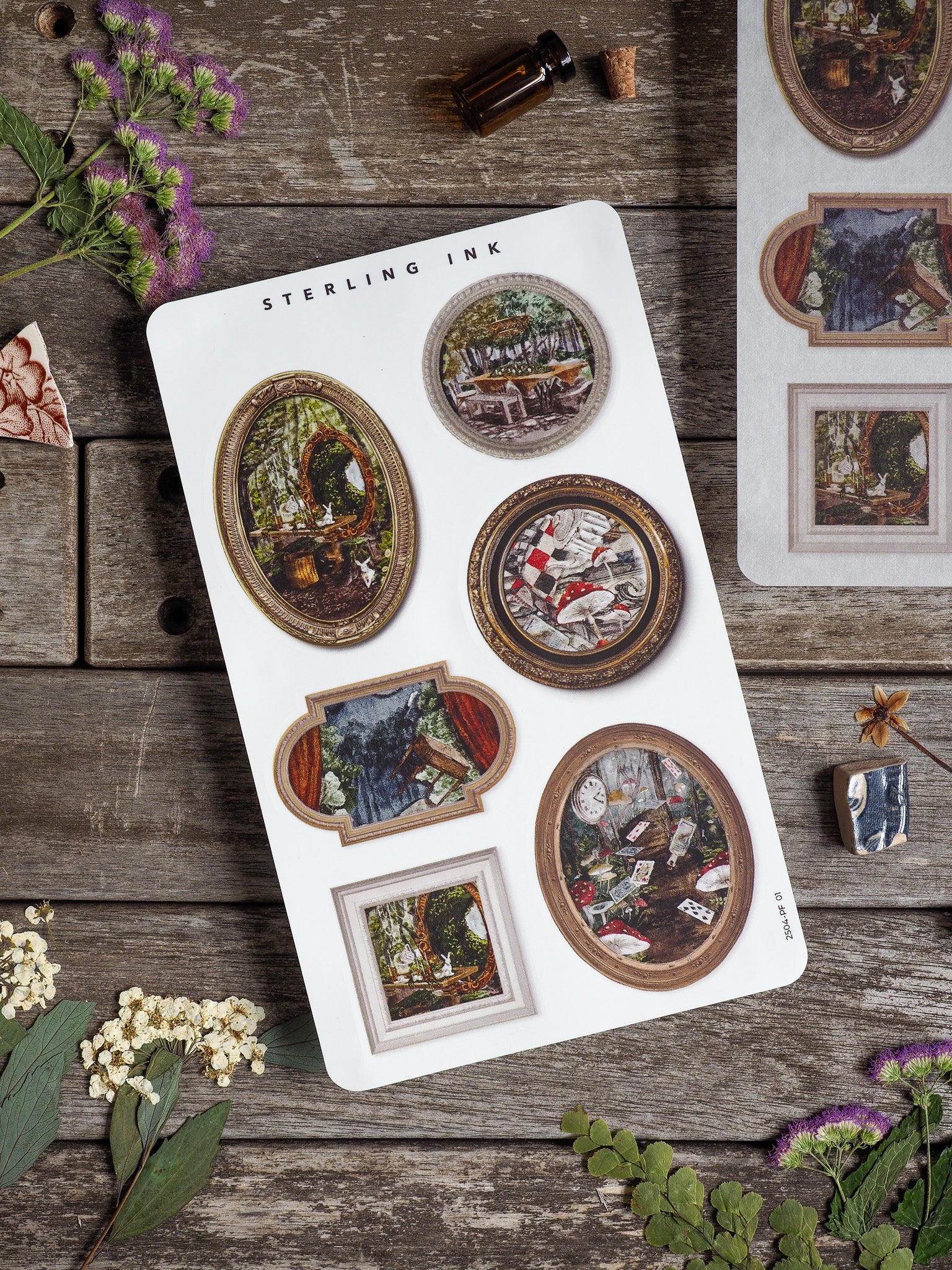Ornate sticker sheet featuring a variety of vintage picture frames showcasing rustic and moody vignettes of landscapes, cozy interiors, and detailed antique scenes.