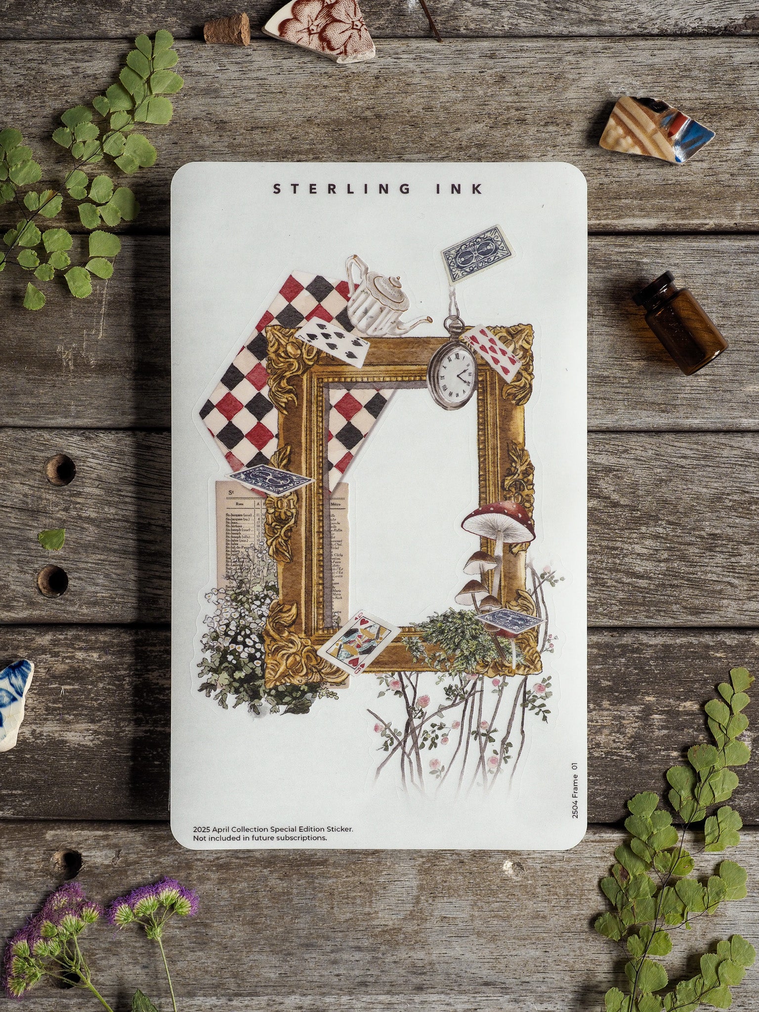 Ornate gold frame sticker featuring vintage documents, checkered patterns, botanical illustrations, and antique trinkets for a rustic, decorative touch.