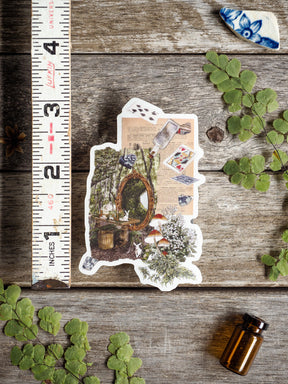 Whimsical April 2025 die-cut sticker featuring a cottagecore forest scene with mushrooms, woven accents, antique botanical sketches, and delicate vintage text.