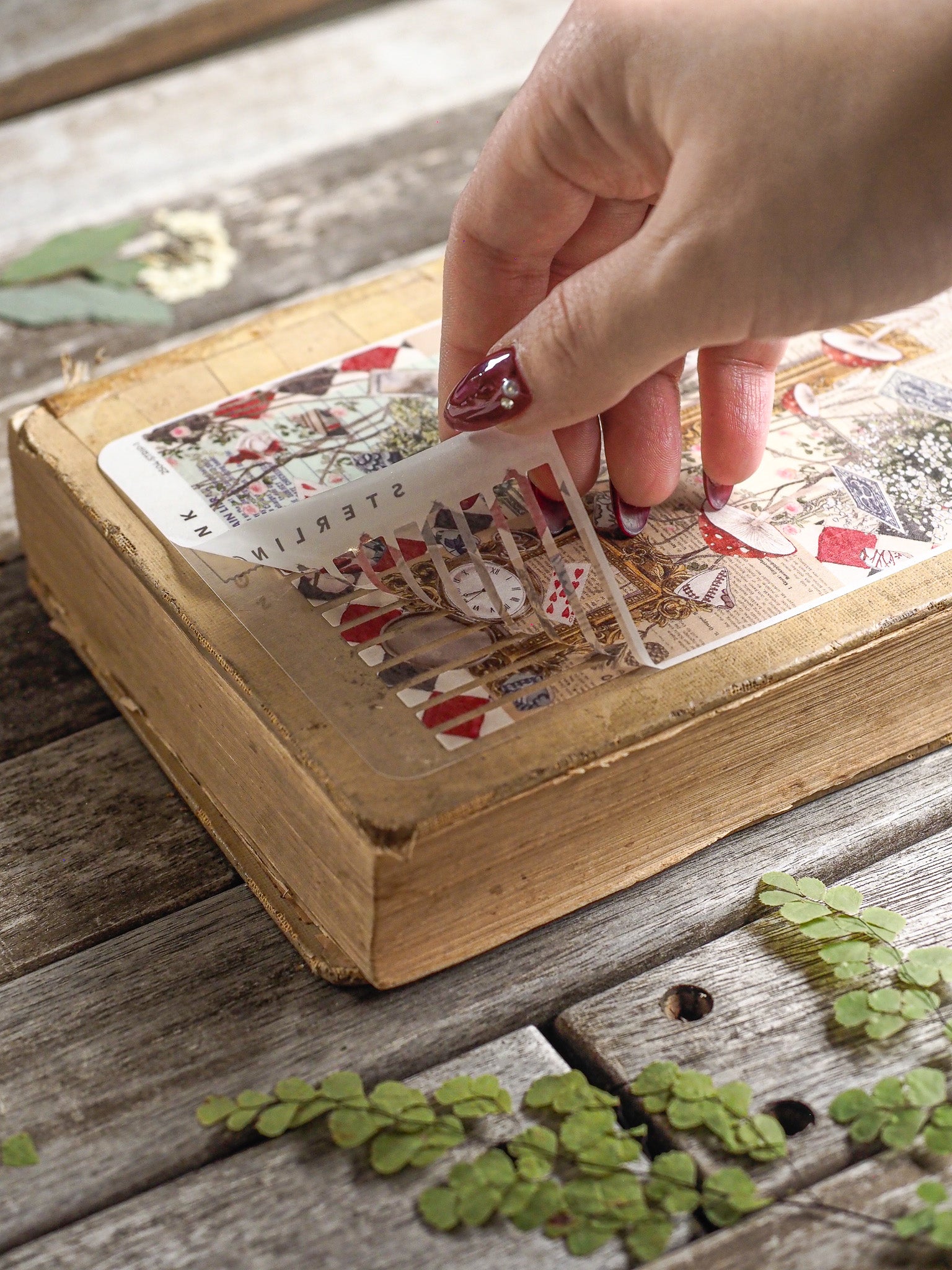 Vintage-themed thin strip stickers featuring distressed collage patterns, prominent red and white checkerboards, and retro decorative lettering perfect for journaling.