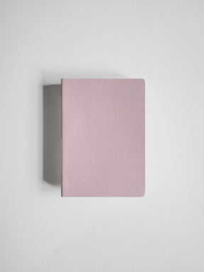 A minimalist, rectangular notebook or journal in a dusty pink color, shown from a top-down perspective on a clean, light gray background.
#Color_Fairyfloss
