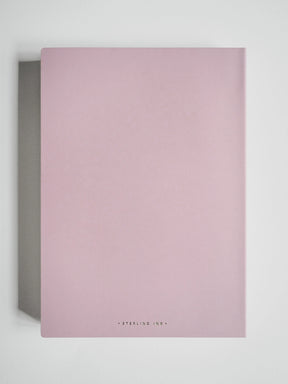 A minimalist pink notebook with a matte finish, featuring the brand name 'STERLING INK' in small black text at the bottom center, displayed against a clean white background.
#Color_Fairyfloss