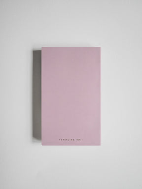 A minimalist pink notebook with 'STERLING INK' printed in small black letters at the bottom, displayed on a clean light gray background.
#Color_Fairyfloss