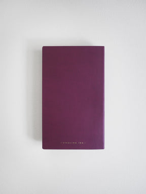 A dark purple notebook or journal with 'STERLING INK.' printed in small gold letters at the bottom, centered on a light gray background.
#Color_Mulberry