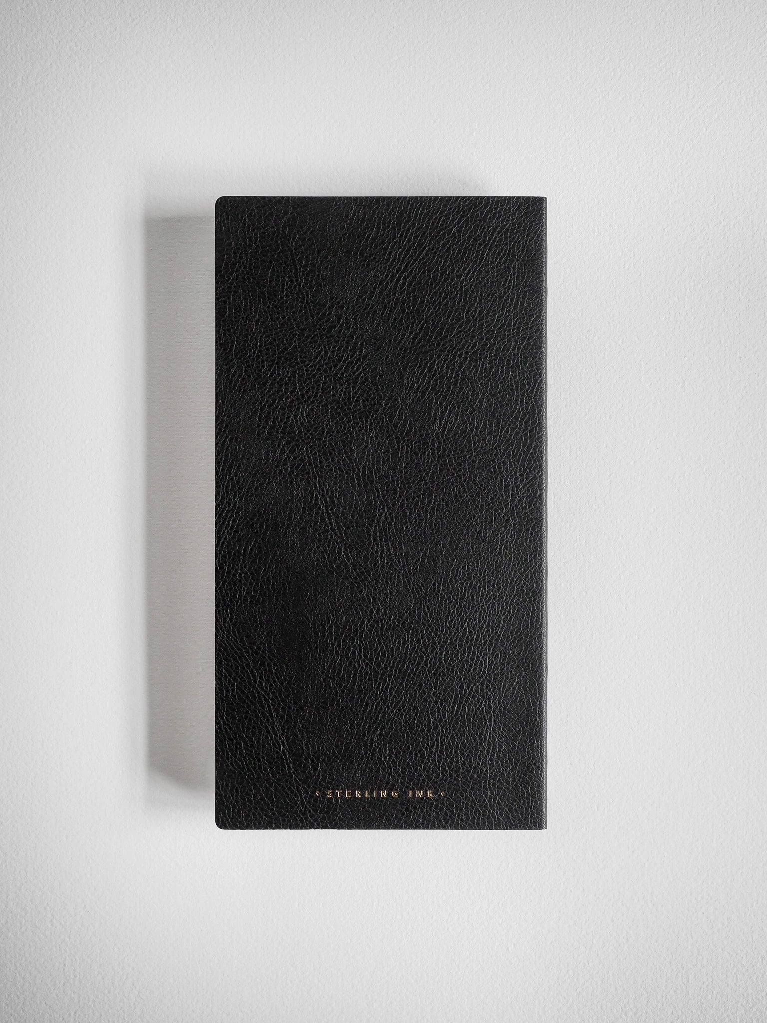 Black notebook with 'Sterling Ink' branding on a light gray background
#Color_Onyx