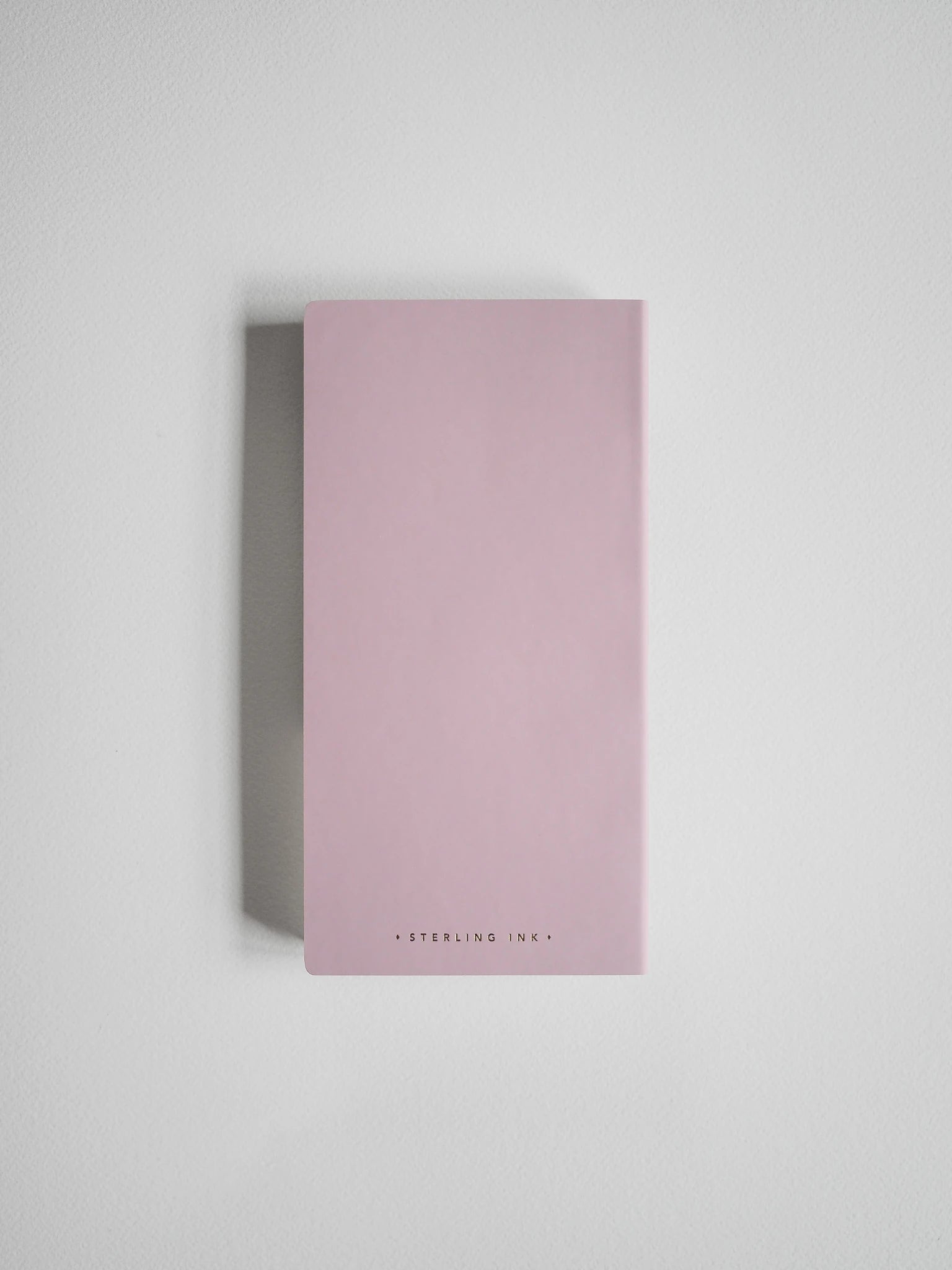 A minimalist, rectangular pink box with the brand name 'STERLING INK' printed in small black letters at the bottom, set against a clean light gray background.
#Color_Fairyfloss