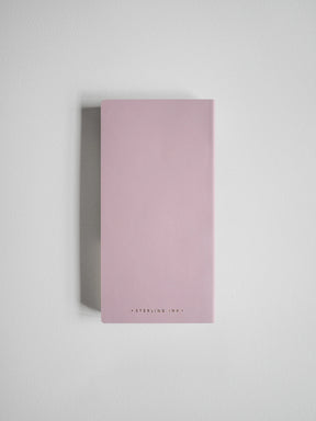A minimalist, rectangular pink box with the brand name 'STERLING INK' printed in small black letters at the bottom, set against a clean light gray background.
#Color_Fairyfloss