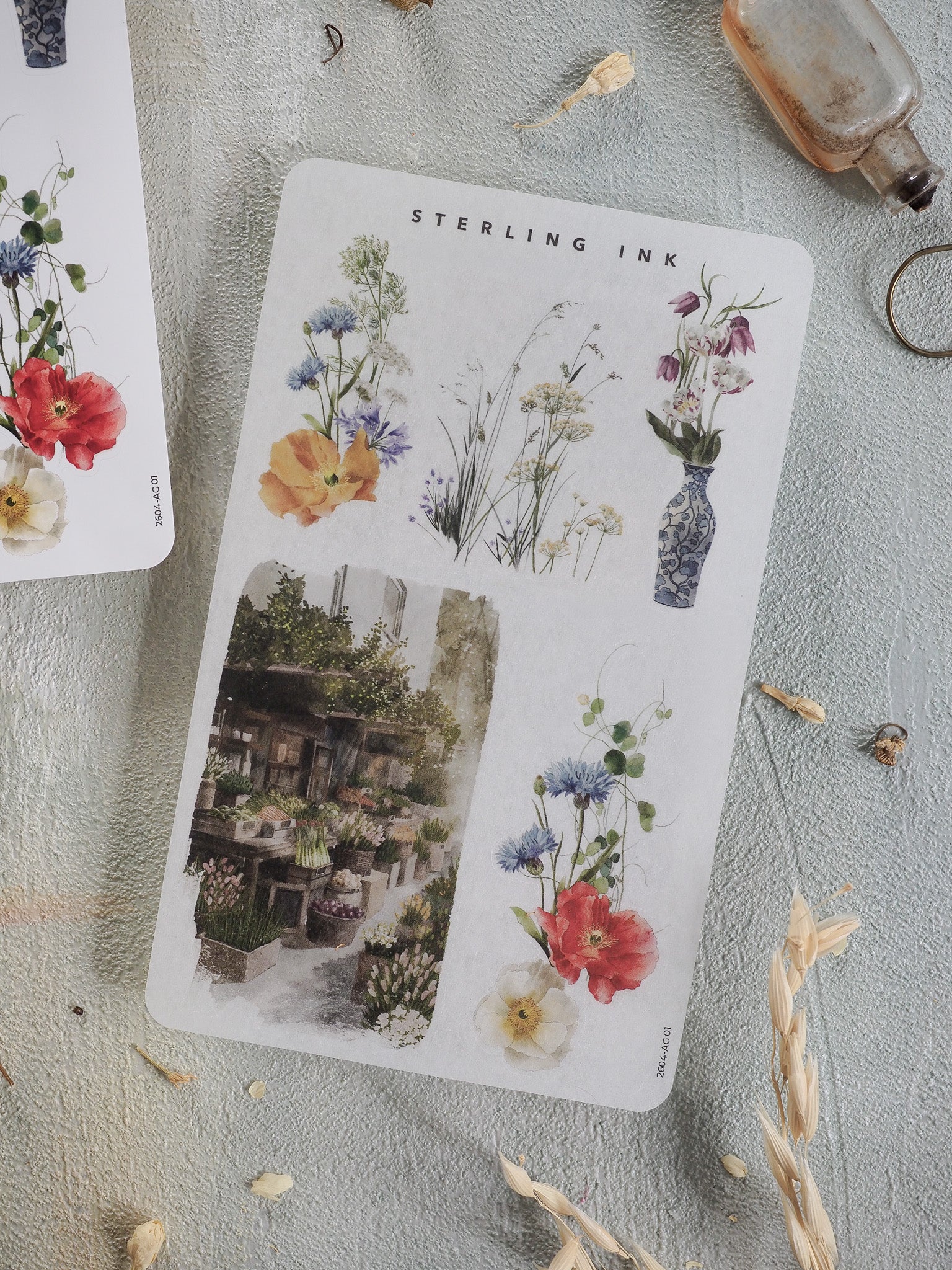 Watercolor sticker sheet featuring vintage botanical arrangements, detailed floral bouquets, and potted plants under the "Sterling Ink" title.