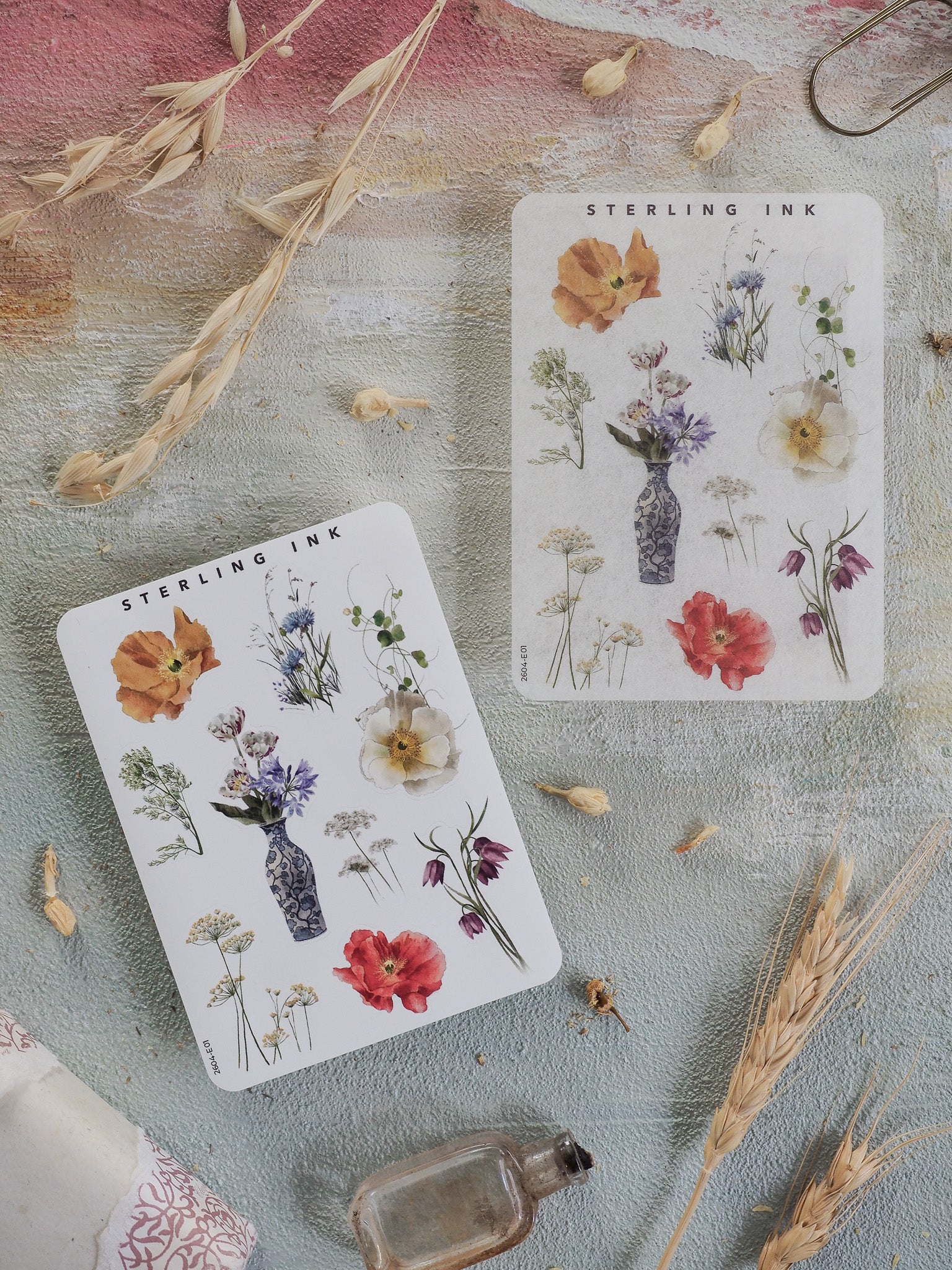Botanical sticker sheet featuring Sterling Ink's detailed floral illustrations, displaying clusters of seasonal flowers, bouquets, and botanical elements in watercolor styles.