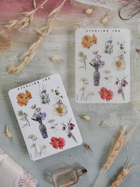 Botanical sticker sheet featuring Sterling Ink's detailed floral illustrations, displaying clusters of seasonal flowers, bouquets, and botanical elements in watercolor styles.
