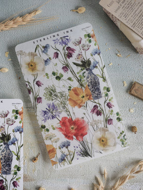 Vibrant watercolor floral sticker strip featuring a lush bouquet of spring blooms, including poppies and tulips, in shades of red, blue, and yellow.