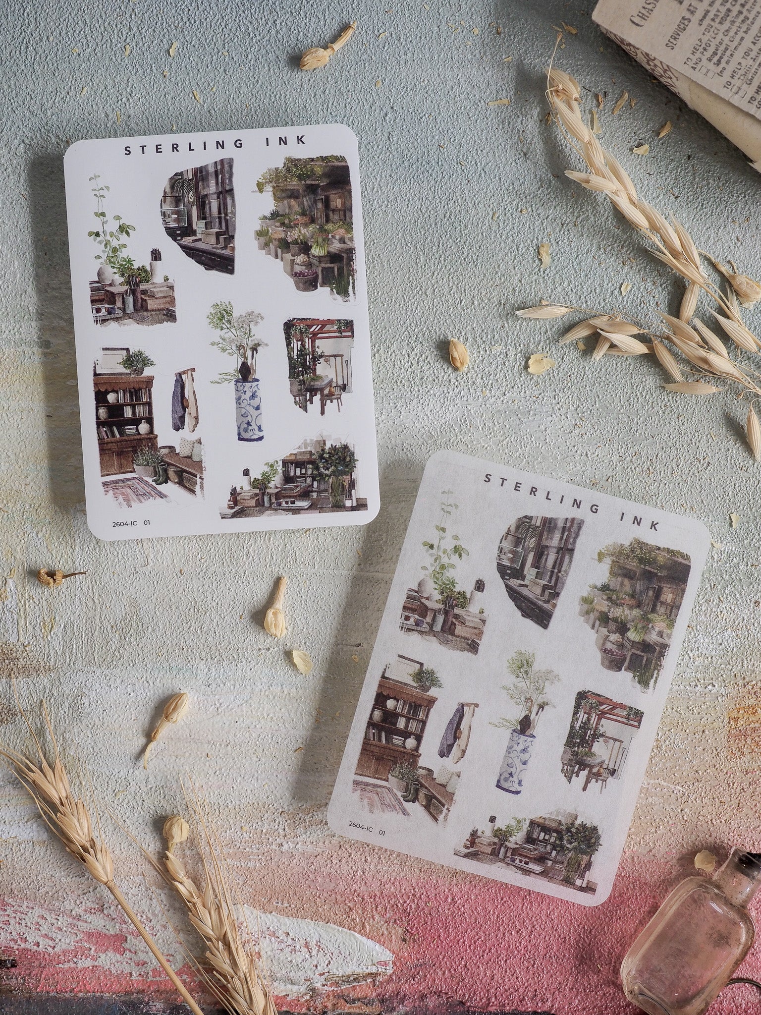 A sheet of decorative iconography featuring vintage, monochromatic illustrations of architectural elements, miniature buildings, and detailed domestic scenes.