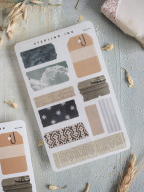Diverse journaling sticker sheet featuring various torn tape patterns, including starry nights, floral motifs, cloudscapes, and neutral striped washi tapes.