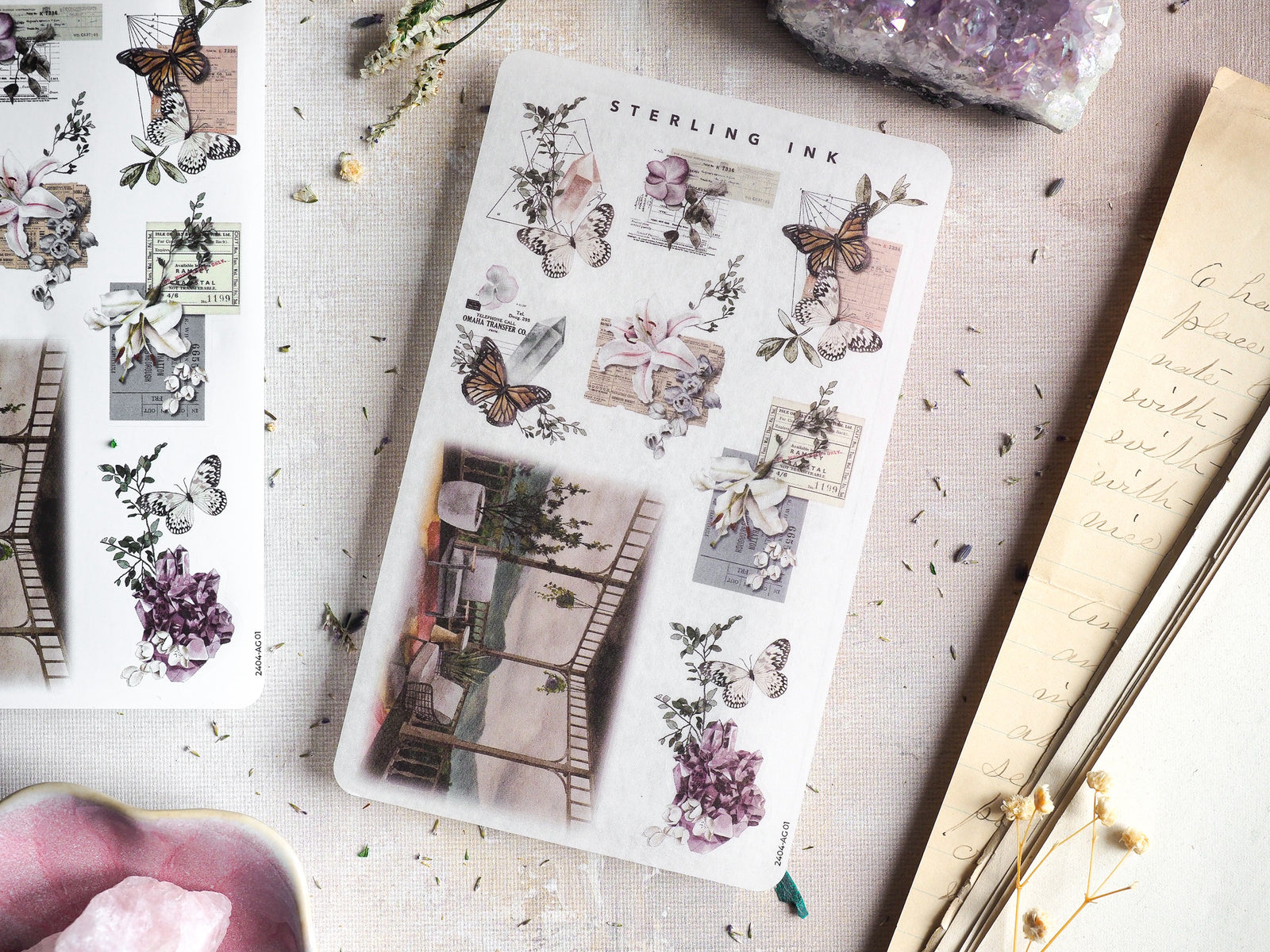 Vintage journaling stickers featuring delicate illustrated butterflies, muted lilac florals, and sepia-toned archival elements like sketch postcards.