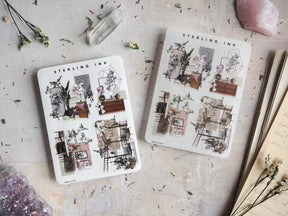 Decorative sticker sheets featuring detailed black-and-white line art icons of potted plants, antique furniture, and delicate architectural sketches.