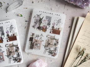 Vintage sticker sheets featuring intricate sepia-toned architectural blueprints and detailed vignettes of charming buildings and indoor scenes.