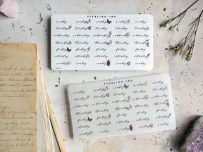 Three white sheets of decorative stickers featuring a vintage "STERLING INK" label and repeating script names surrounded by delicate, elegant floral patterns.