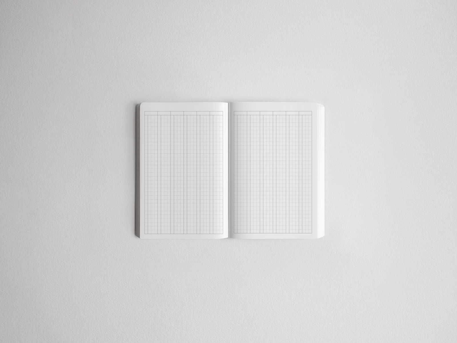 Open notebook displaying dual-layout pages with intersecting vertical and horizontal grids, ideal for versatile note-taking and planning.