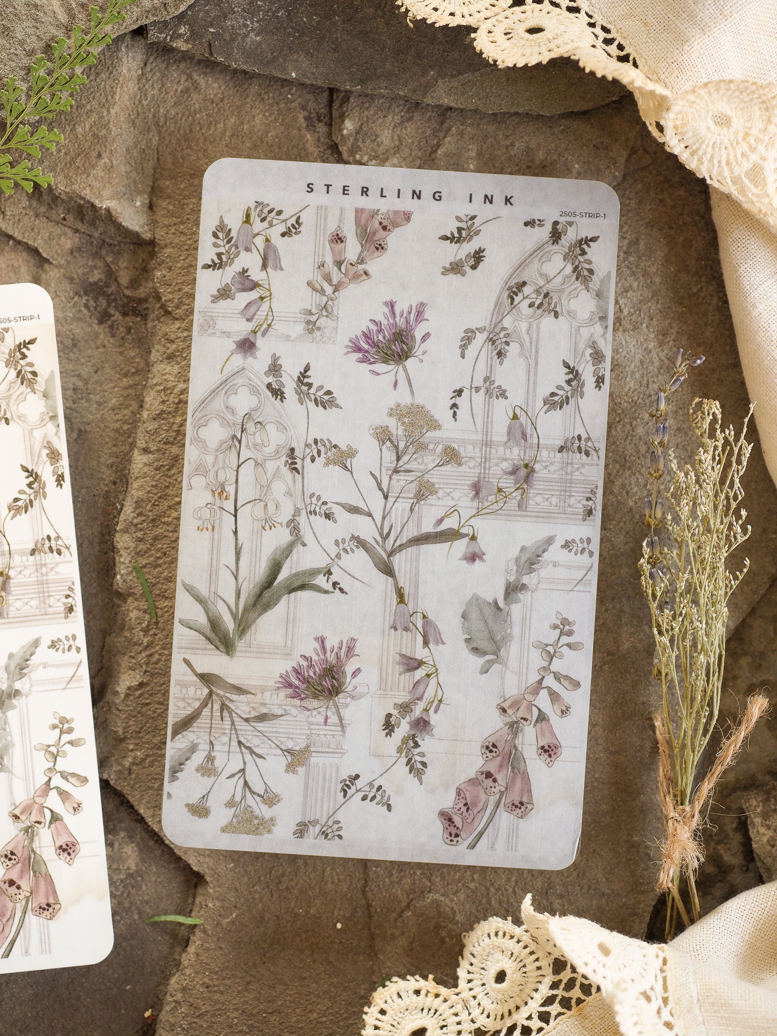Watercolor botanical strip stickers featuring soft pastel shades of dried purple and pink flowers, arranged in delicate foliage patterns.