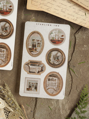 Vintage architectural sticker sheet featuring sepia-toned, framed illustrations of charming buildings and detailed facades, perfect for scrapbooking.