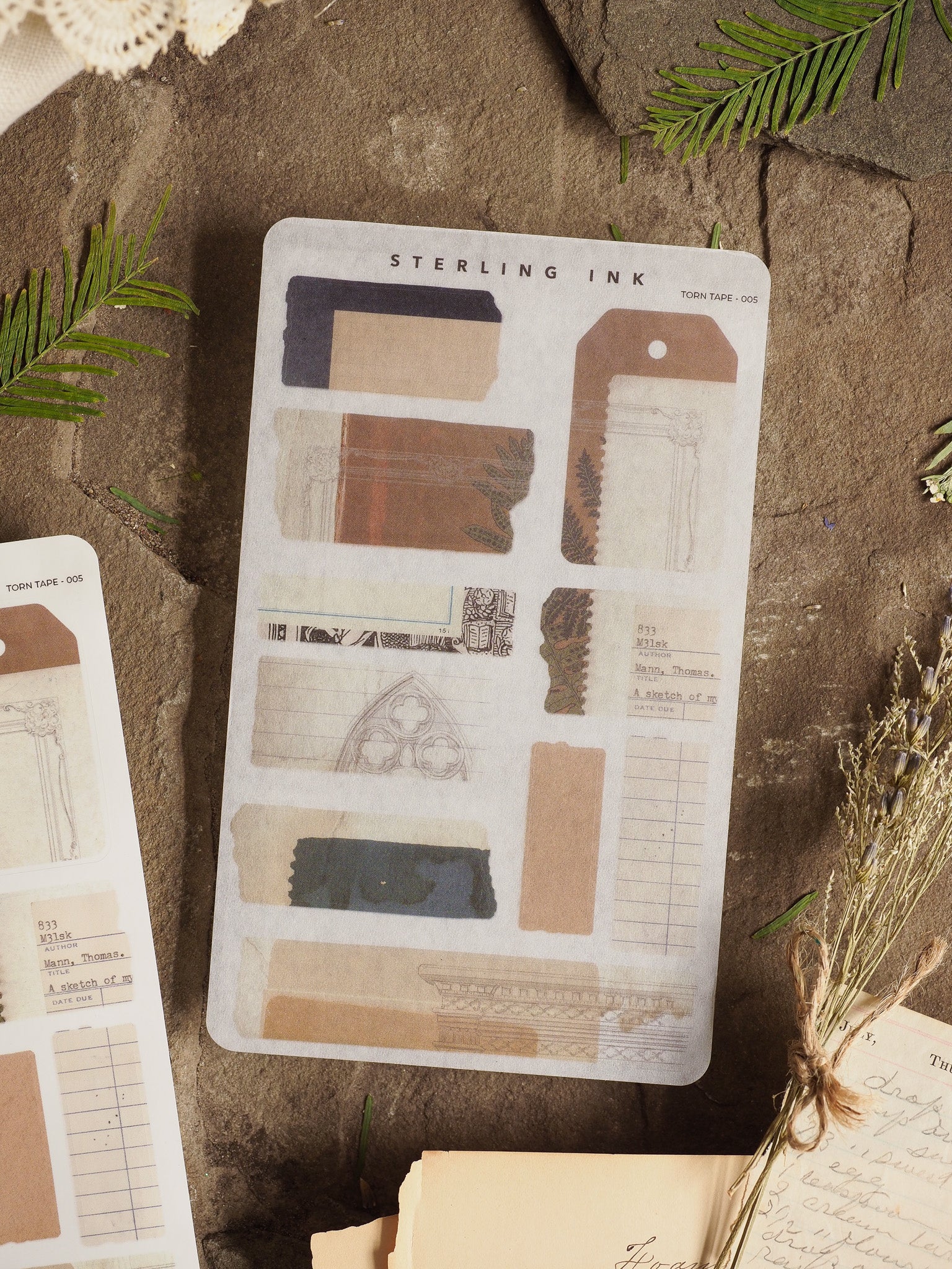 Assorted vintage-style scrapbook stickers featuring faux aged paper strips, decorative labels, and varying muted tones ideal for journal journaling and crafting.