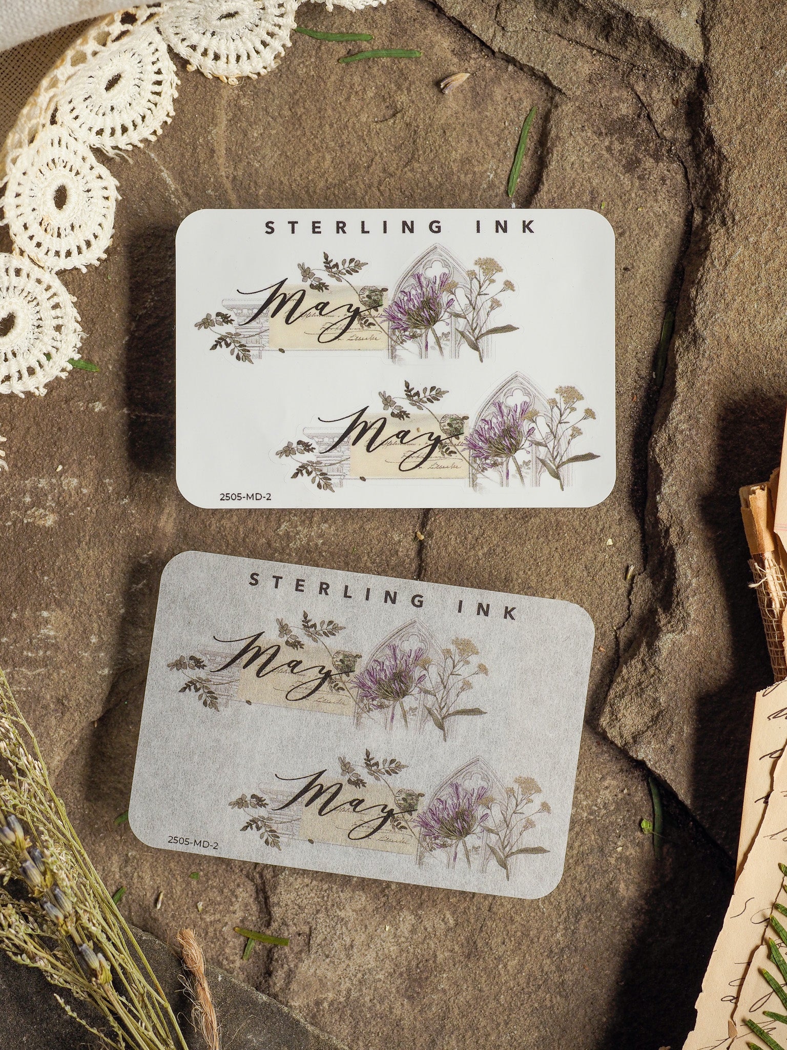 May-themed sticker set adorned with delicate watercolor illustrations of lavender and lush foliage, centered around the elegant script typography of "May."