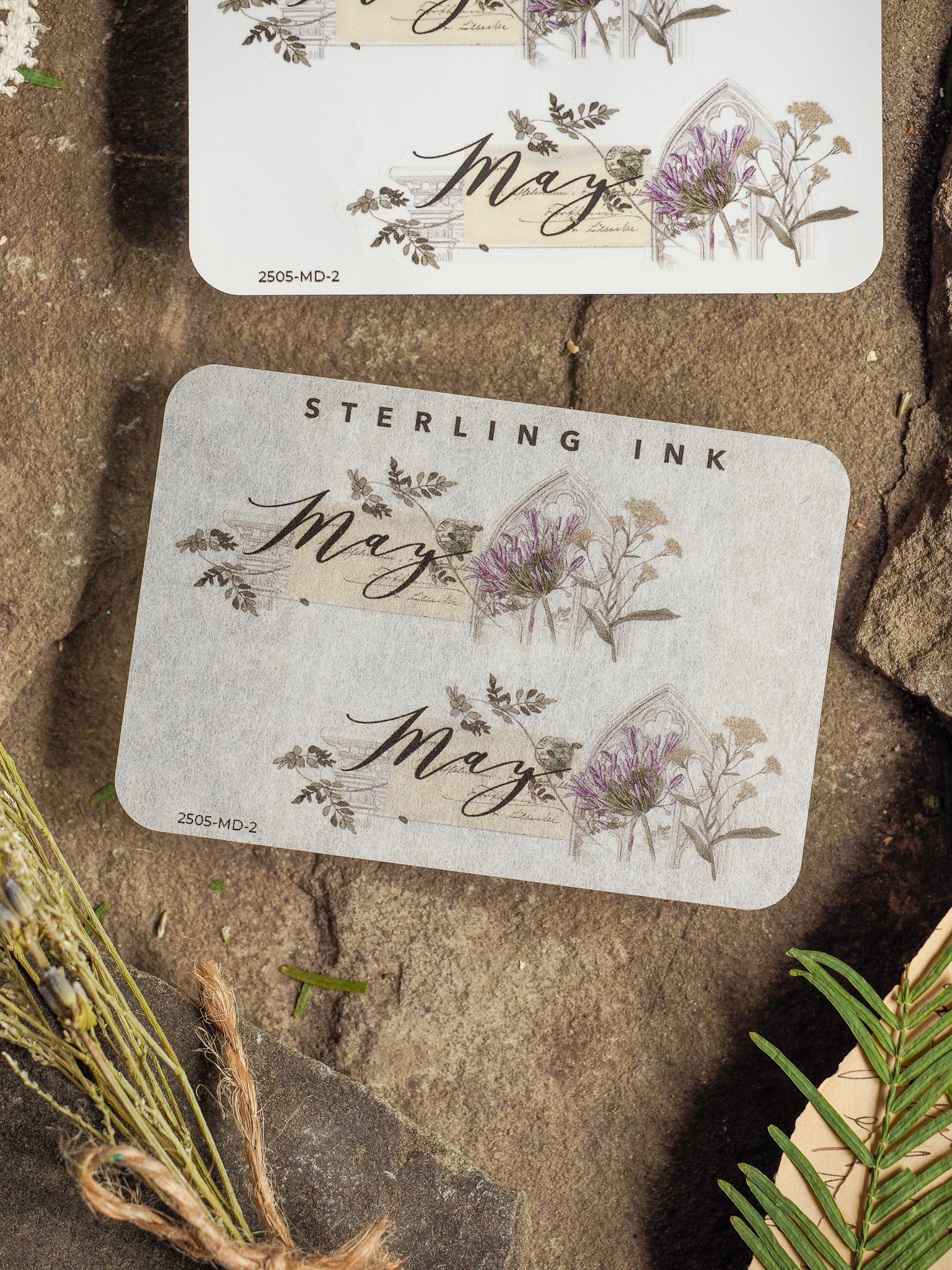 Natural month sticker with a soft, watercolor bouquet design featuring the script word "May" and delicate spring wildflowers for crafting.