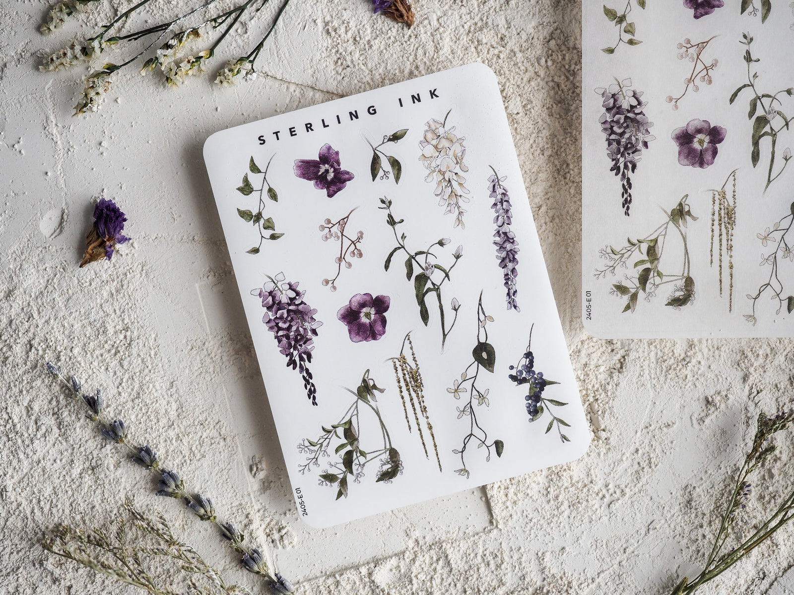 Watercolor floral sticker set featuring elegant botanical elements, including clusters of purple lilacs, mixed wildflowers, and delicate green foliage.