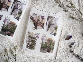 Ornate sticker sheets featuring intricate black and white architectural blueprints, detailed grates, and lush floral diagrams for decorative journaling.