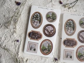 Decorative sticker sheet featuring antique, sepia-toned picture frames showcasing architectural details and overgrown conservatory scenes.