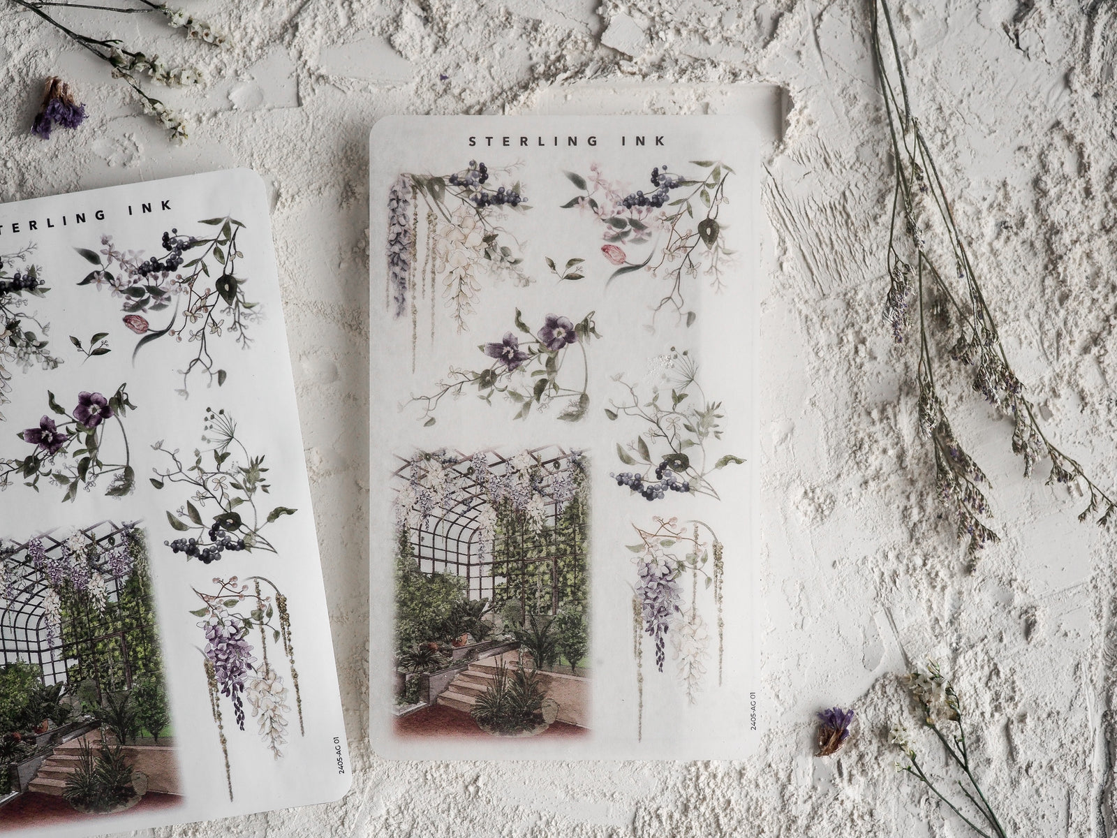 Watercolor arrangement stickers featuring delicate clusters of purple and pink flowers, lush vines, and elegant garden archways.