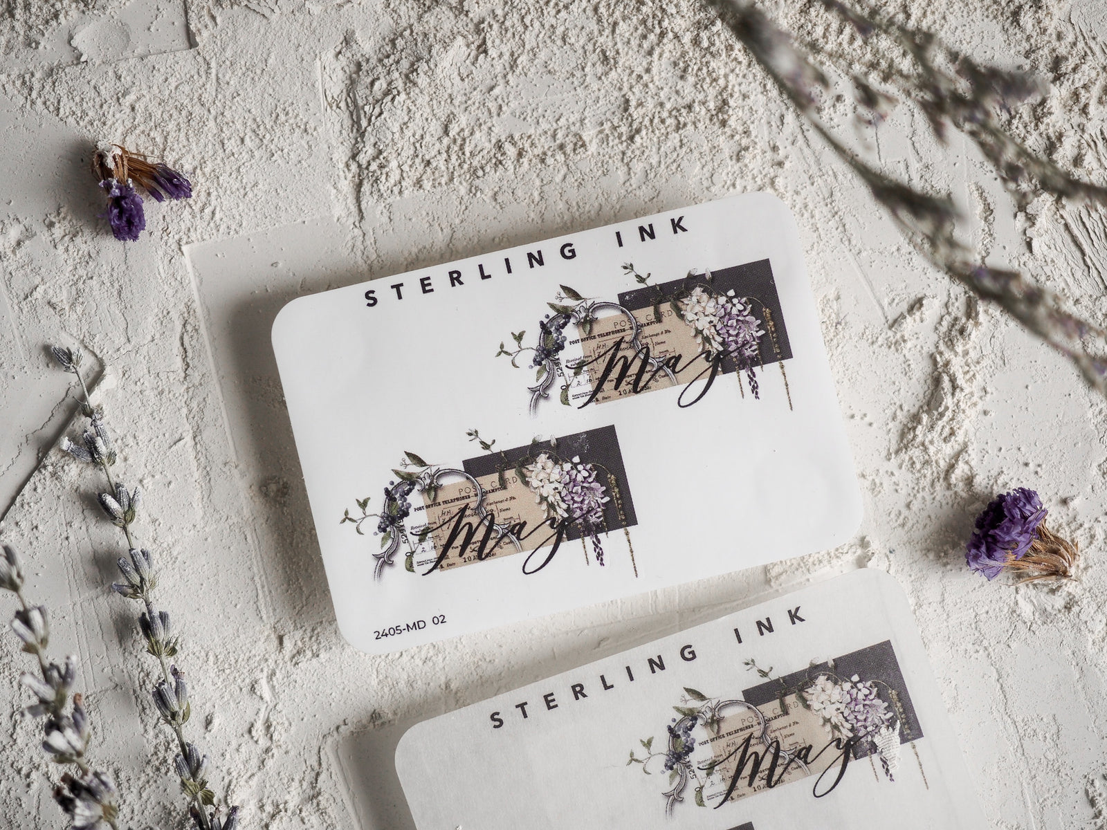 Elegant monthly planner stickers featuring "May" script calligraphy surrounded by dark purple and deep floral illustrations, perfect for journaling.