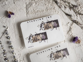 Elegant monthly planner stickers featuring "May" script calligraphy surrounded by dark purple and deep floral illustrations, perfect for journaling.
