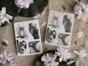 Vintage sticker sheets featuring botanical and architectural collages of arches, ruined structures, and flourishing florals in muted tones.