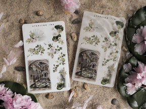 Sticker sheets featuring romantic botanical clusters and vintage illustrations of classical, sepia-toned arches for journaling and crafting.