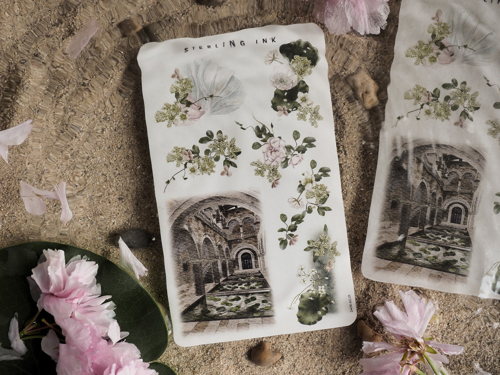 Watercolor floral arrangements and a detailed, vintage etching of a ruined archway are featured on this decorative June 2024-themed sheet.