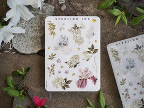 Elegant sticker sheet featuring delicate clusters of muted watercolor botanicals, including dusty roses, cream blooms, and lush green foliage.