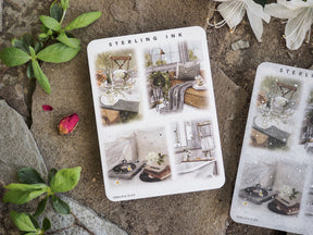 Detailed sticker sheets featuring delicate watercolor illustrations of cozy, sunlit interiors, rustic home vignettes, and charming decorative scenes.
