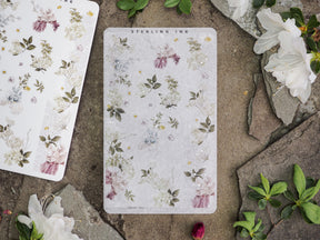 Delicate floral sticker collection featuring pastel watercolor blooms, soft greenery, and subtle gold speckling, perfect for journal decorating.