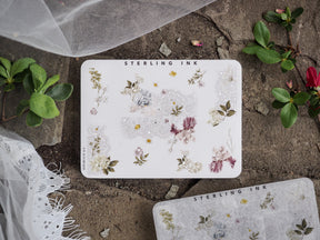 Sheet of delicate, pastel floral corner stickers featuring vintage blossoms and leaves with shimmering silver foil accents.