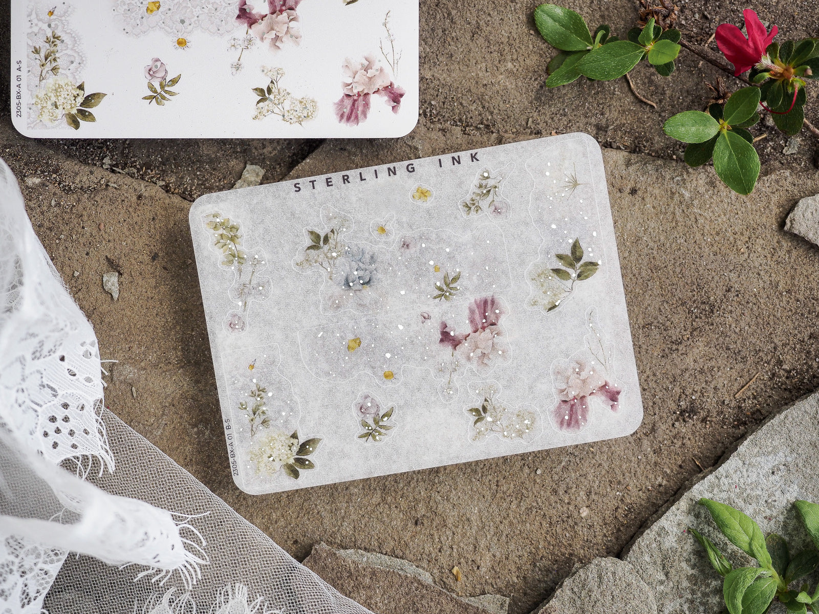 Delicate sticker sheet featuring muted watercolor floral clusters of pink, cream, and sage green blossoms for vintage journaling accents.